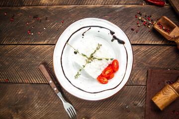 Boiled rice garnish on the wooden table 