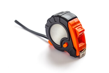 Naklejka premium Orange and black measuring tape on a white background
