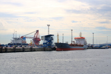 Naklejka premium August 21 2020 - Rostock-Warnemünde, Mecklenburg-Vorpommern/Germany: Details of the industry port and dockside cranes at the europort harbour in Rostock