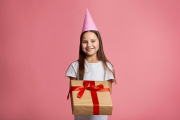 Is it for me. Little kid girl in cap hold gift box and big