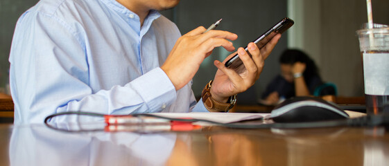 Businessmen, write messages and look for contacts on your mobile phone