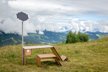 Table with solar panel in mountains