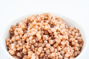 Sorghum rice in a bowl on white background