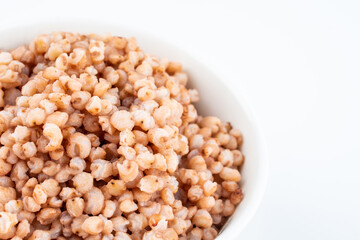 Sorghum rice in a bowl on white background