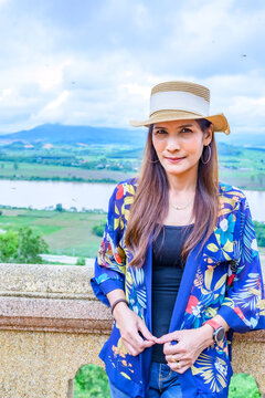 A Woman Traveler with Mekong River Background at Chiang Saen District
