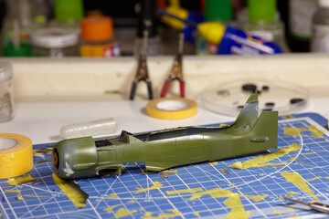 Plastic case of combat aircraft with new painting of khaki color, assembled and painted by hand....