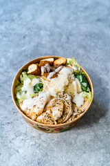 Take Away Healthy Organic Ceaser Salad with Chicken, Parmesan Cheese, Crouton Bread and Yogurt Mayonnaise Sauce.