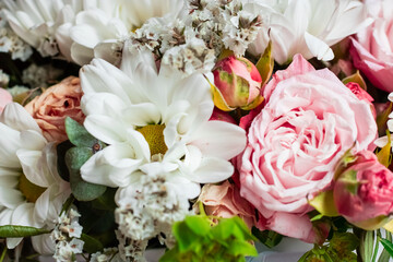 Delicate pink and white flowers in green foliage. Bouquet