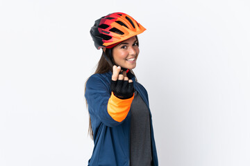 Young cyclist brazilian girl isolated on white  background making money gesture