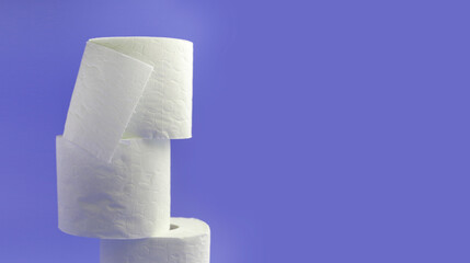 White toilet paper rolls on the gray background. Hygiene concept.