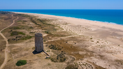 Sand beaches aerial bird view with drone next to El Palmar with Castilnovo tower next to the ocean