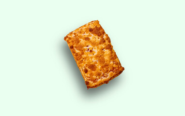 Rectangular shortbread with a shadow, isolated on a light green background. Confectionery.
