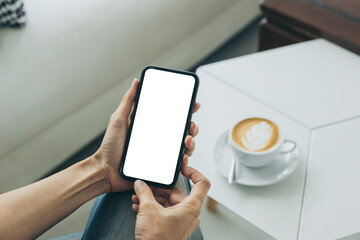 cell phone mockup blank white screen.woman hand holding texting using mobile on desk at coffee shop.background empty space for advertise.work people contact marketing business,technology