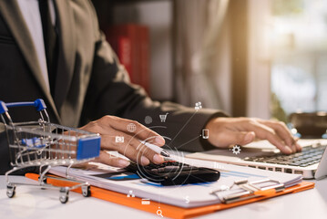 Women working at home about online business. Business owner women using calculator and smart phone working at home.