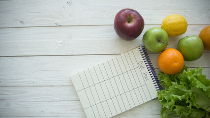 Diet food and diet plan on wooden  background