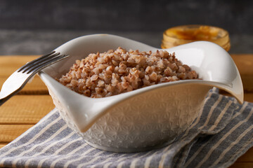 Boiled buckwheat porridge with butter served in a plate
