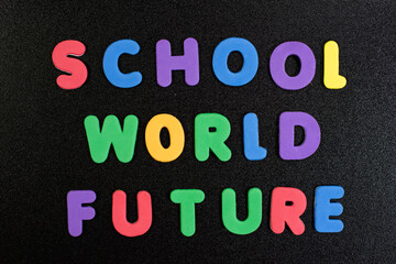 School world future word written with colorful foam alphabets on black board background children kids school photo