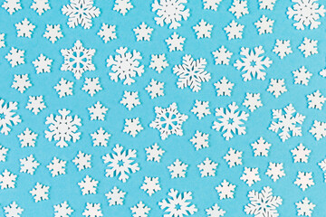 Set of white snowflakes on colorful background. Top view of Christmas ornament. New Year time concept with empty space for your design