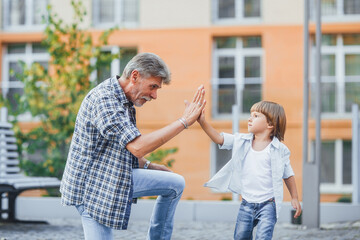 Grandfather with a grandson on a walk