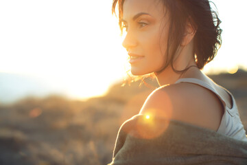 Beautiful woman. Portrait of a beautiful young girl at sunset. High quality photo.