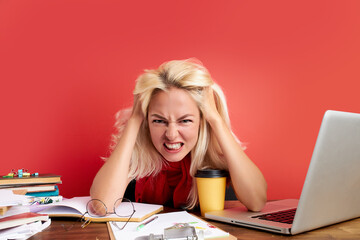 disappointed caucasian woman is dazed and confused by a mistake in official documents at work, sit...