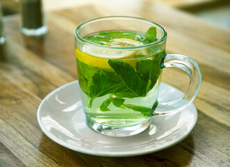 Tea with fresh mint leaves and lemon.