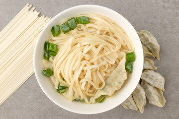 Dumpling Kalguksu on a white background