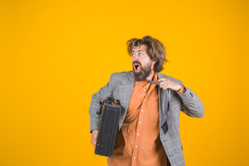 Businessman. Office worker. Confused businessman with suitcase. CEO. Bearded businessman in suit. Business, people and office concept. Messy bearded businessman with case.