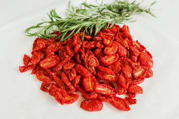 Homemade sun-Dried tomatoes with fresh rosemary. The view from the top. Print for kitchen