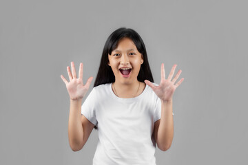 Asian girl studio portrait on gray background