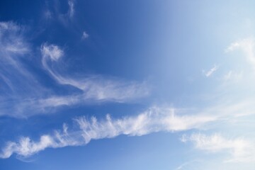 White cirrocumulus clouds in the blue sky. Beautiful sky background