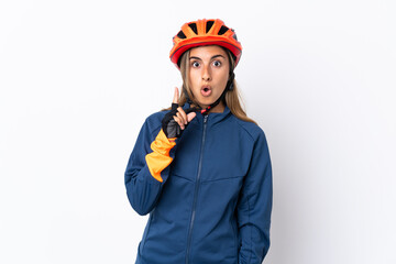 Young hispanic cyclist woman isolated on white background intending to realizes the solution while lifting a finger up