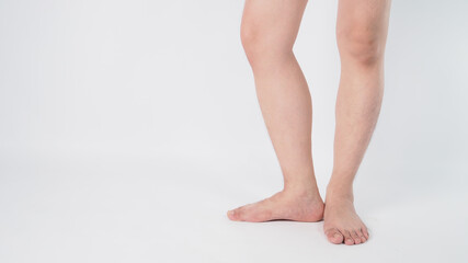 Male legs and barefoot is isolated on white background.