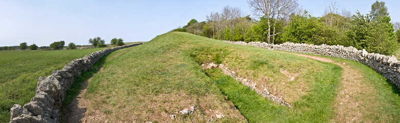 Belas Knap is a neolithic, chambered long barrow situated on Cleeve Hill, near Cheltenham and Winchcombe, in Gloucestershire, England.