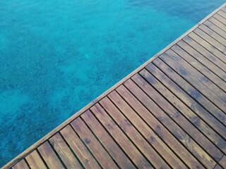 Top view wooden floor and sea background