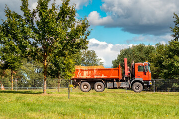 Heavy dump truck transporting sand