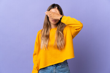 Young hispanic woman over isolated purple background covering eyes by hands. Do not want to see...