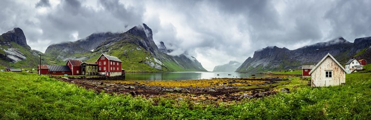 Panorama of traditional houses of the village of Kirkefjord during a rainy day on the Lofoten islands, Norway