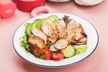 fitness and active healthy lifestyles Concept.A plate of chicken breast salad