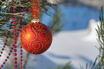 Christmas tree and ball on  background  with  snow.