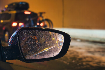 Dramatic and dangerous weather conditions on the road of Croatia through the blurred side mirror of car - heavy hail storm