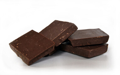 Dark chocolate cubes stack on white background