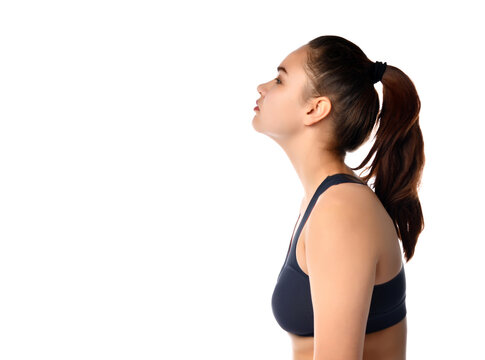 Side view of a tired female athlete on a white background.
