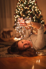Woman holding Christmas lights