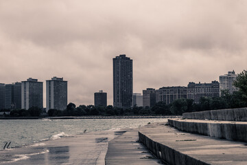 Residential buildings behind Lake Michigan on cloudy day