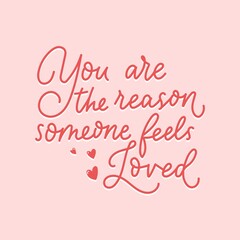 You are the reason someone feels loved inspirational red lettering quote isolated on pink background. Motivational quote about love and kindness for greeting cards, posters etc. Vector illustration