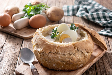 Zurek. Traditional Polish soup on wooden table	