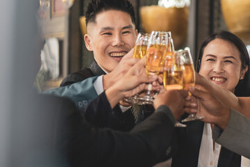 Asian business people drinking celebrate happy business success
