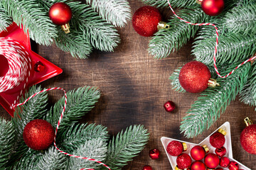 Christmas background. Red ornaments on spruce branches. Christmas Flatlay. Top view from copyspace