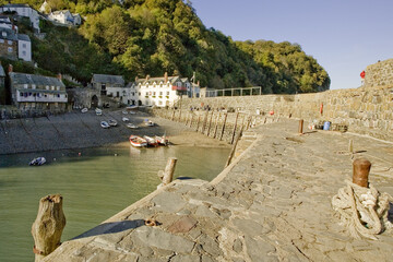 Clovelly is a harbour village in the Torridge district of Devon, England. Its steep pedestrianised cobbled main street, donkeys and views over the Bristol Channel attract numerous tourists.